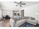 Open-concept living area with hardwood floors, seamlessly connecting the living room and kitchen spaces at 5638 Berney Cir, Powder Springs, GA 30127