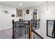 Open loft area showcasing a versatile space with railing overlooking stairs at 5638 Berney Cir, Powder Springs, GA 30127