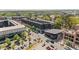 Aerial view showcasing the mixed-use development with retail and residential buildings, streetscape, and well-maintained landscaping at 127 Ravenhurst Dr, Fayetteville, GA 30214