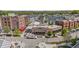 Aerial view features inviting streetscape with local businesses, outdoor dining, and charming architecture at 127 Ravenhurst Dr, Fayetteville, GA 30214
