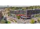 Aerial view shows modern commercial building with outdoor dining, manicured landscaping, and convenient parking at 127 Ravenhurst Dr, Fayetteville, GA 30214