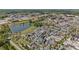 This aerial view highlights the community with serene pond and attractive buildings at 127 Ravenhurst Dr, Fayetteville, GA 30214