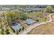 Aerial view of a community showcasing sports courts, a park, and residential neighborhood at 127 Ravenhurst Dr, Fayetteville, GA 30214