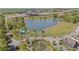 Expansive view of the community featuring the pond, play area, walking paths, and residences at 127 Ravenhurst Dr, Fayetteville, GA 30214