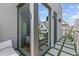 Modern balcony featuring stone tiles and synthetic grass offers an outdoor space with stylish seating at 127 Ravenhurst Dr, Fayetteville, GA 30214