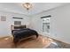 Bedroom with hardwood floors and natural light at 127 Ravenhurst Dr, Fayetteville, GA 30214
