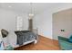 Bright bedroom features hardwood floors, closet and a view of the attached bathroom at 127 Ravenhurst Dr, Fayetteville, GA 30214