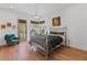 Stylish bedroom features a metal bed frame, hardwood floors, and eclectic decor at 127 Ravenhurst Dr, Fayetteville, GA 30214
