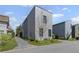 Modern home exterior shows a light gray facade with adjacent homes and a driveway at 127 Ravenhurst Dr, Fayetteville, GA 30214