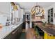 Bright kitchen featuring custom cabinets, quartz countertops, a waterfall island, and modern lighting fixtures at 127 Ravenhurst Dr, Fayetteville, GA 30214