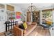 Bright living room with hardwood floors, a comfortable leather sofa, and stylish decor at 127 Ravenhurst Dr, Fayetteville, GA 30214