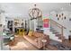 Stylish living room featuring hardwood floors, comfortable seating, and open access to the kitchen at 127 Ravenhurst Dr, Fayetteville, GA 30214