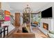 Well-lit living room with modern furnishings, a fireplace, and stylish accents at 127 Ravenhurst Dr, Fayetteville, GA 30214