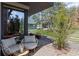Outdoor patio with cozy seating, a small table, and views of a landscaped yard at 127 Ravenhurst Dr, Fayetteville, GA 30214