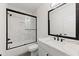 Well-lit bathroom with marble countertop and glass shower doors at 2059 Mozelle Dr, Marietta, GA 30062