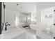 Bathroom featuring marble countertops, a glass shower, soaking tub, and a separate toilet room at 2059 Mozelle Dr, Marietta, GA 30062