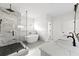 Elegant bathroom featuring a freestanding tub, glass shower and marble countertops at 2059 Mozelle Dr, Marietta, GA 30062