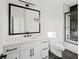 Well-lit bathroom with marble countertop and glass shower doors at 2059 Mozelle Dr, Marietta, GA 30062