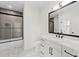 Well-lit bathroom featuring modern finishes, vanity, and shower and tub combination at 2059 Mozelle Dr, Marietta, GA 30062
