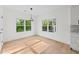 Cozy breakfast nook with hardwood floors, natural light, and views of the lush outdoors at 2059 Mozelle Dr, Marietta, GA 30062