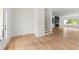 Bright entryway featuring hardwood floors, staircase, and a glimpse of the fireplace at 2059 Mozelle Dr, Marietta, GA 30062