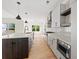 Stylish kitchen with stainless steel appliances, large center island, and hardwood floors at 2059 Mozelle Dr, Marietta, GA 30062