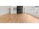 Open living room with hardwood floors, fireplace, and built-in shelves at 2059 Mozelle Dr, Marietta, GA 30062