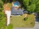 Lovely property with a spacious front lawn, long driveway, and a beautiful in-ground pool in the backyard at 215 The Farm Rd, Mcdonough, GA 30252