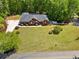 A gorgeous property with a well-maintained lawn and a private pool in the backyard at 215 The Farm Rd, Mcdonough, GA 30252