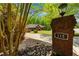 Inviting brick home with a well-maintained lawn and an address marker on the front entrance at 215 The Farm Rd, Mcdonough, GA 30252