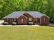Charming single-Gathering home with a manicured lawn and traditional design at 215 The Farm Rd, Mcdonough, GA 30252