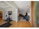 Inviting foyer featuring hardwood floors, a glimpse of a living room with a fireplace, and a separate exercise area at 215 The Farm Rd, Mcdonough, GA 30252