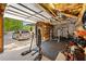 Spacious garage with high ceilings, a workout area, and exterior access to the driveway at 215 The Farm Rd, Mcdonough, GA 30252