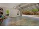 Spacious garage with access to the backyard, basketball court, and nature at 215 The Farm Rd, Mcdonough, GA 30252