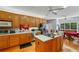 Well-equipped kitchen with wooden cabinets, a kitchen island, and modern appliances at 215 The Farm Rd, Mcdonough, GA 30252