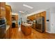Spacious kitchen featuring wood cabinets, stainless steel appliances, and a convenient center island at 215 The Farm Rd, Mcdonough, GA 30252