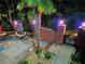Outdoor patio with seating area and manicured landscaping at 215 The Farm Rd, Mcdonough, GA 30252