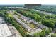 Aerial view of the community, surrounded by lush trees and showing the neighborhood layout at 3409 Catalan Aly, Decatur, GA 30032