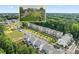 Community aerial view showcases the lush greenery, adjacent building inset shows nearby businesses at 3409 Catalan Aly, Decatur, GA 30032