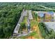 Expansive aerial view of community and surrounding trees, with nearby building inset at 3409 Catalan Aly, Decatur, GA 30032