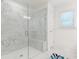 Modern bathroom features a glass shower with marble-patterned tile and built-in bench at 3409 Catalan Aly, Decatur, GA 30032