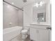 Clean, modern bathroom with white vanity, toilet, and shower/tub combo at 3409 Catalan Aly, Decatur, GA 30032