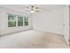 Bright bedroom featuring neutral carpet, white trim, and natural light at 3409 Catalan Aly, Decatur, GA 30032