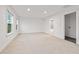 Spacious bedroom with plush neutral carpet and plenty of light from two windows at 3409 Catalan Aly, Decatur, GA 30032