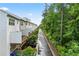 The townhome community is nestled next to a dense green space offering backyard decks with garages and plentiful parking at 3409 Catalan Aly, Decatur, GA 30032
