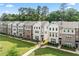 Attractive exterior showcases brick and siding details, complemented by manicured landscaping at 3409 Catalan Aly, Decatur, GA 30032