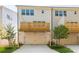 Modern townhomes with garage, carport, and small lawns at 3409 Catalan Aly, Decatur, GA 30032