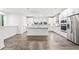 Spacious kitchen with a large island, stainless steel appliances, white cabinetry, and hardwood flooring at 3409 Catalan Aly, Decatur, GA 30032