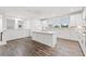 Bright, white kitchen featuring an island, stainless steel appliances, and a window overlooking the backyard at 3409 Catalan Aly, Decatur, GA 30032