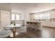 Modern eat in kitchen with an island, bar stools, sleek countertops, and ample cabinet space at 3409 Catalan Aly, Decatur, GA 30032